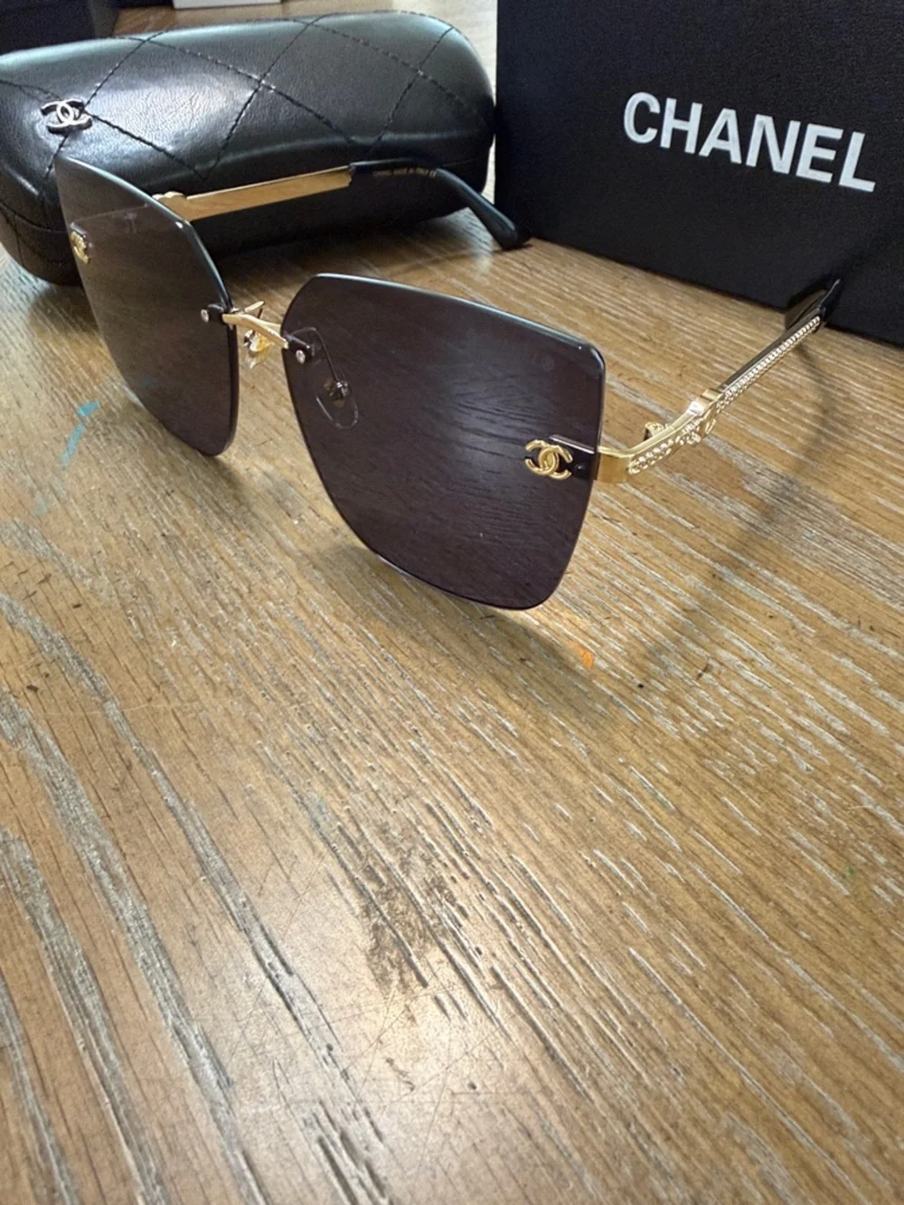 Chanel Women's Black and Gold Rimless Square Sunglasses